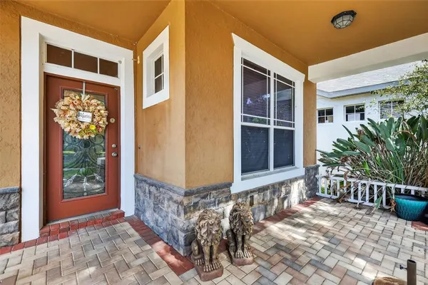 a front view of a house with a large window