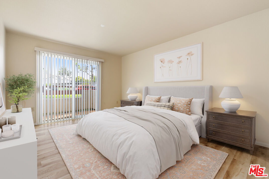 445 Ribbon Beach Way, Unit 277 Oceanside, CA 92058 - Photo 16 of 28 a bedroom with a bed a mirror and a window