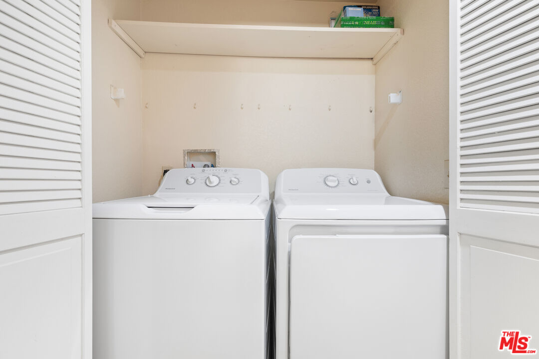 445 Ribbon Beach Way, Unit 277 Oceanside, CA 92058 - Photo 22 of 28 a utility room with dryer and washer