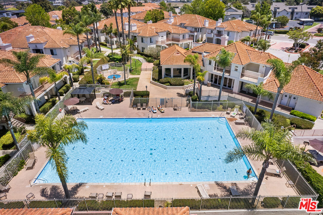 445 Ribbon Beach Way, Unit 277 Oceanside, CA 92058 - Photo 24 of 28 a view of multiple houses with a yard