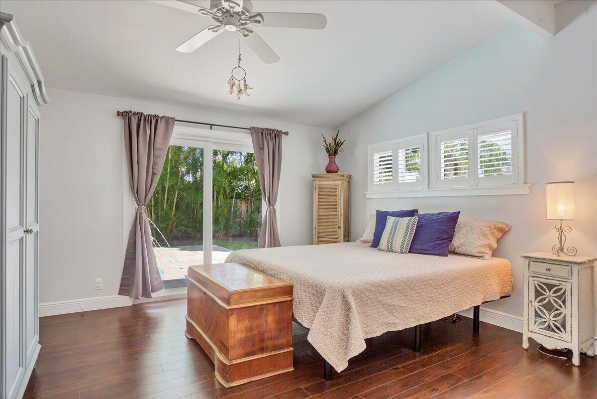 1110 Southwest 15th Street Boca Raton, FL 33486 - Photo 16 of 41 a living room with a bed furniture and a large window