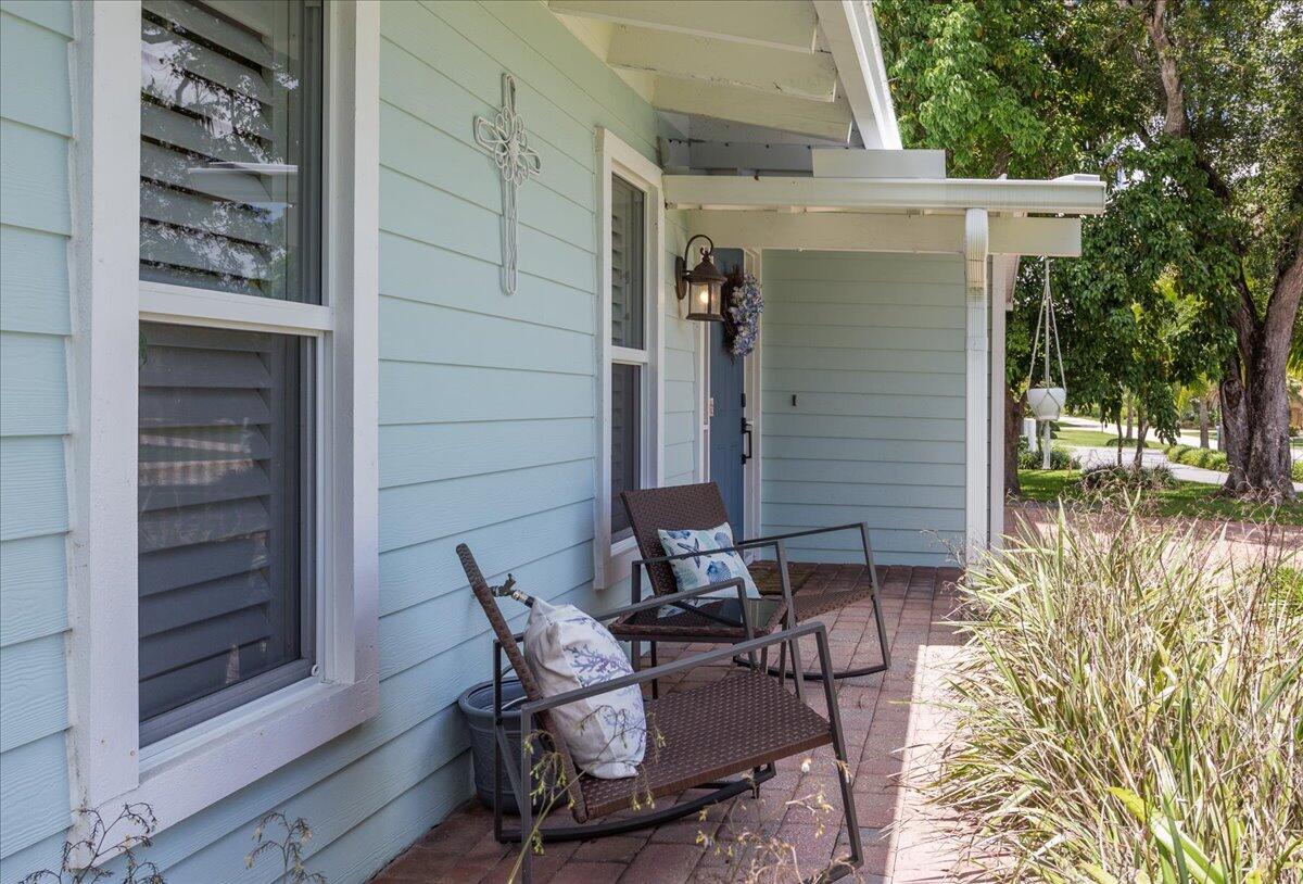 1110 Southwest 15th Street Boca Raton, FL 33486 - Photo 36 of 41 a patio with table and chairs and potted plants