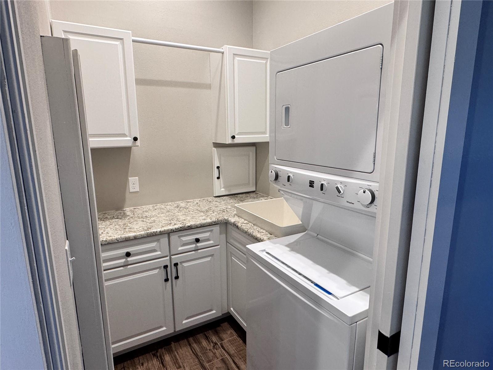 563 Kankakee Road Westcliffe, CO 81252 - Photo 11 of 46 a view of washer and dryer with wooden floor