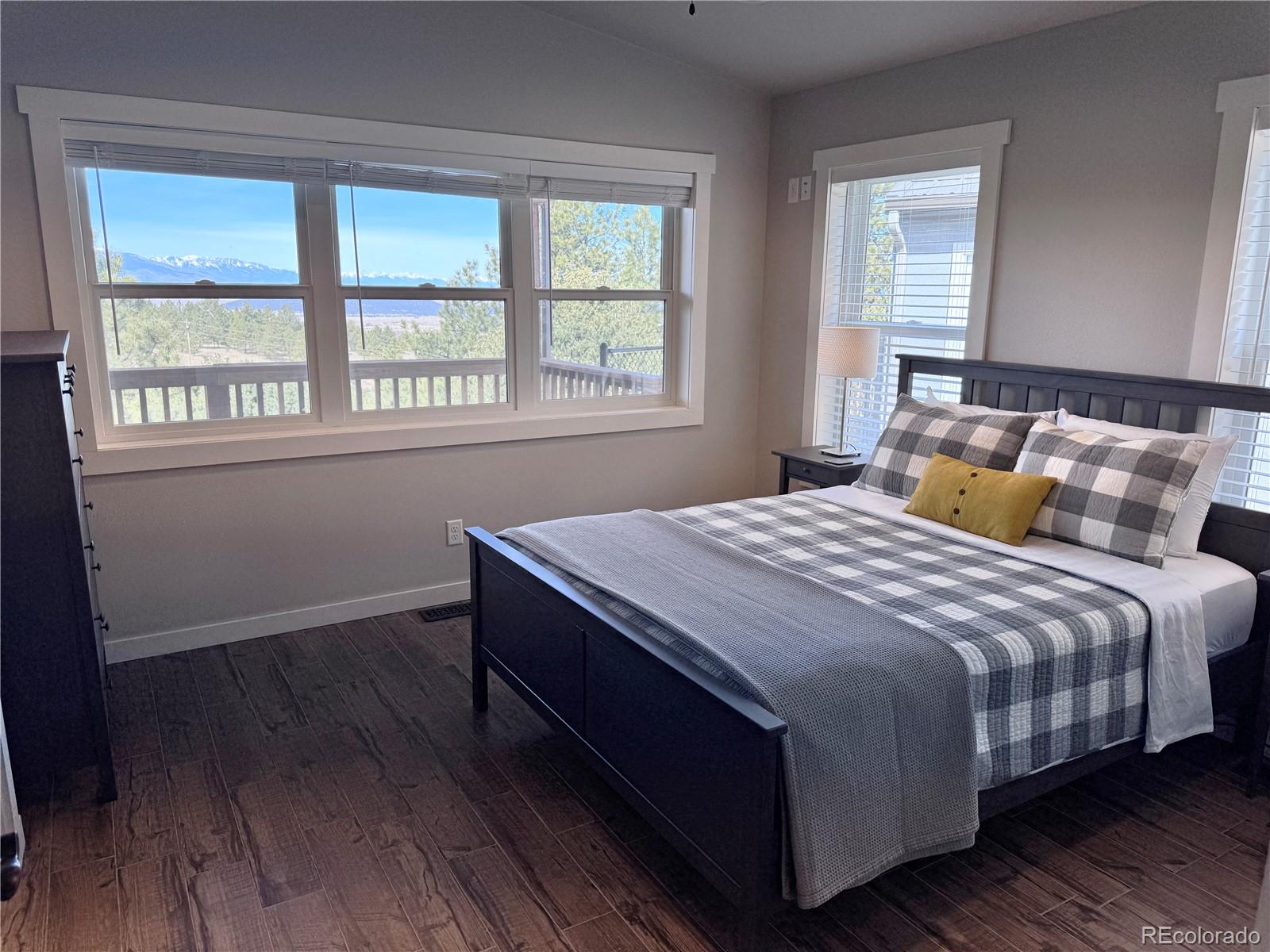 563 Kankakee Road Westcliffe, CO 81252 - Photo 13 of 46 a bedroom with a bed and window