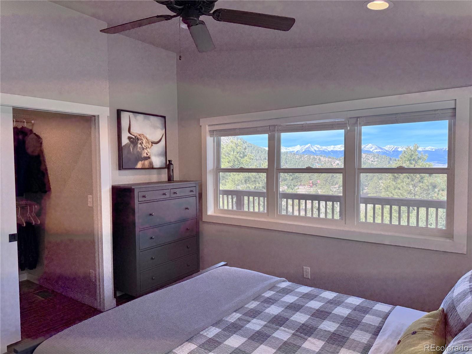 563 Kankakee Road Westcliffe, CO 81252 - Photo 14 of 46 a bedroom with a bed and a window