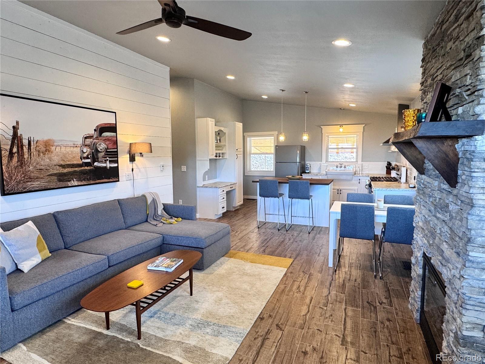 563 Kankakee Road Westcliffe, CO 81252 - Photo 19 of 46 a living room with furniture and a fireplace