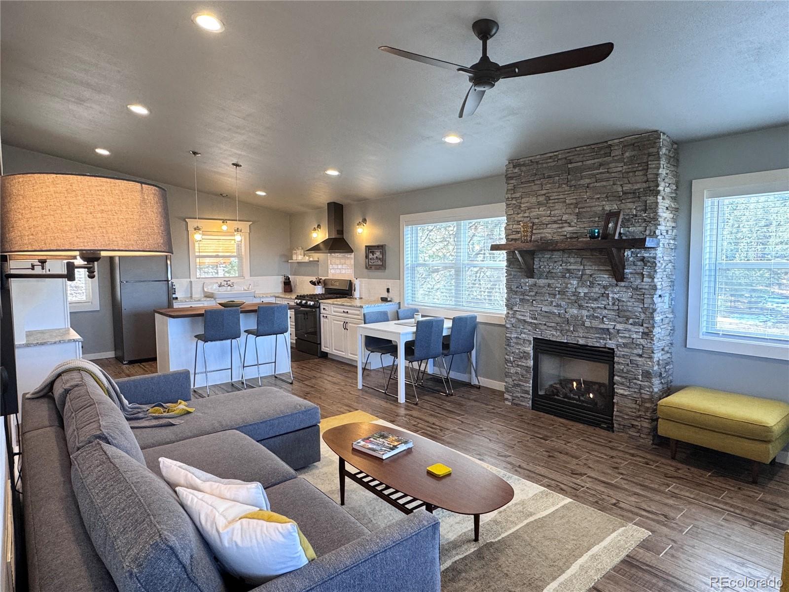 563 Kankakee Road Westcliffe, CO 81252 - Photo 21 of 46 a living room with furniture and a fireplace