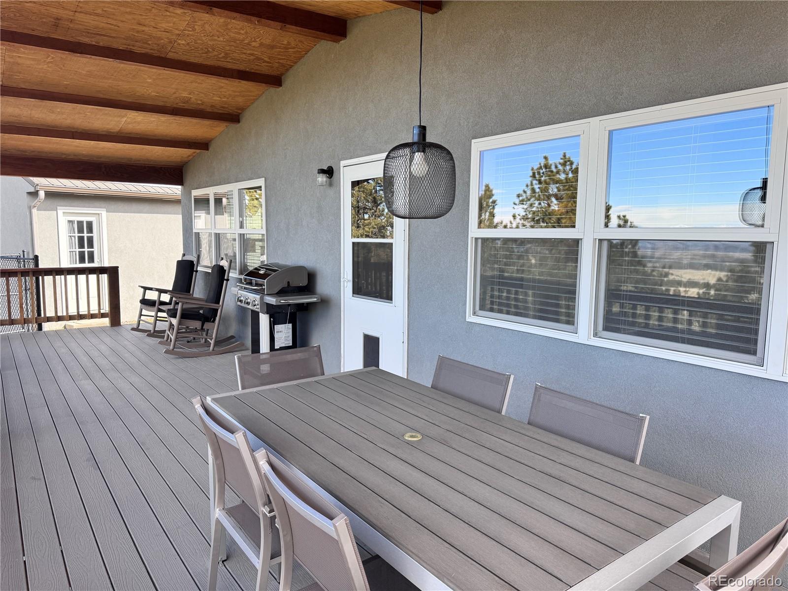 563 Kankakee Road Westcliffe, CO 81252 - Photo 25 of 46 a view of a dining room with furniture window and wooden floor