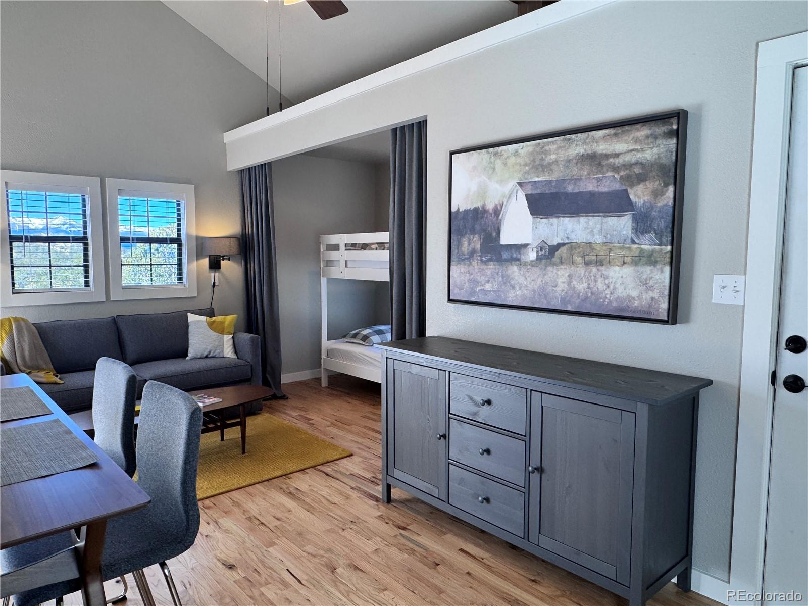 563 Kankakee Road Westcliffe, CO 81252 - Photo 30 of 46 a living room with furniture and a flat screen tv