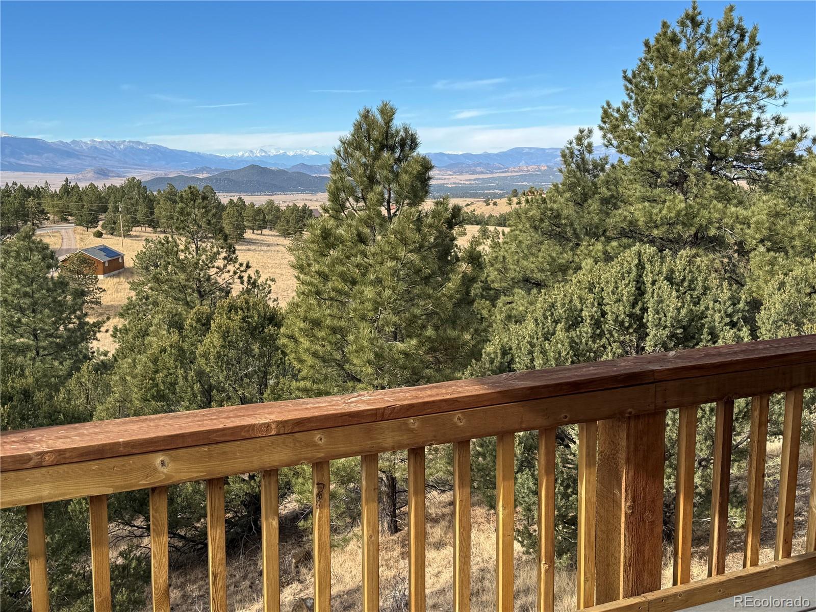 563 Kankakee Road Westcliffe, CO 81252 - Photo 31 of 46 a view of a balcony with wooden floor and fence
