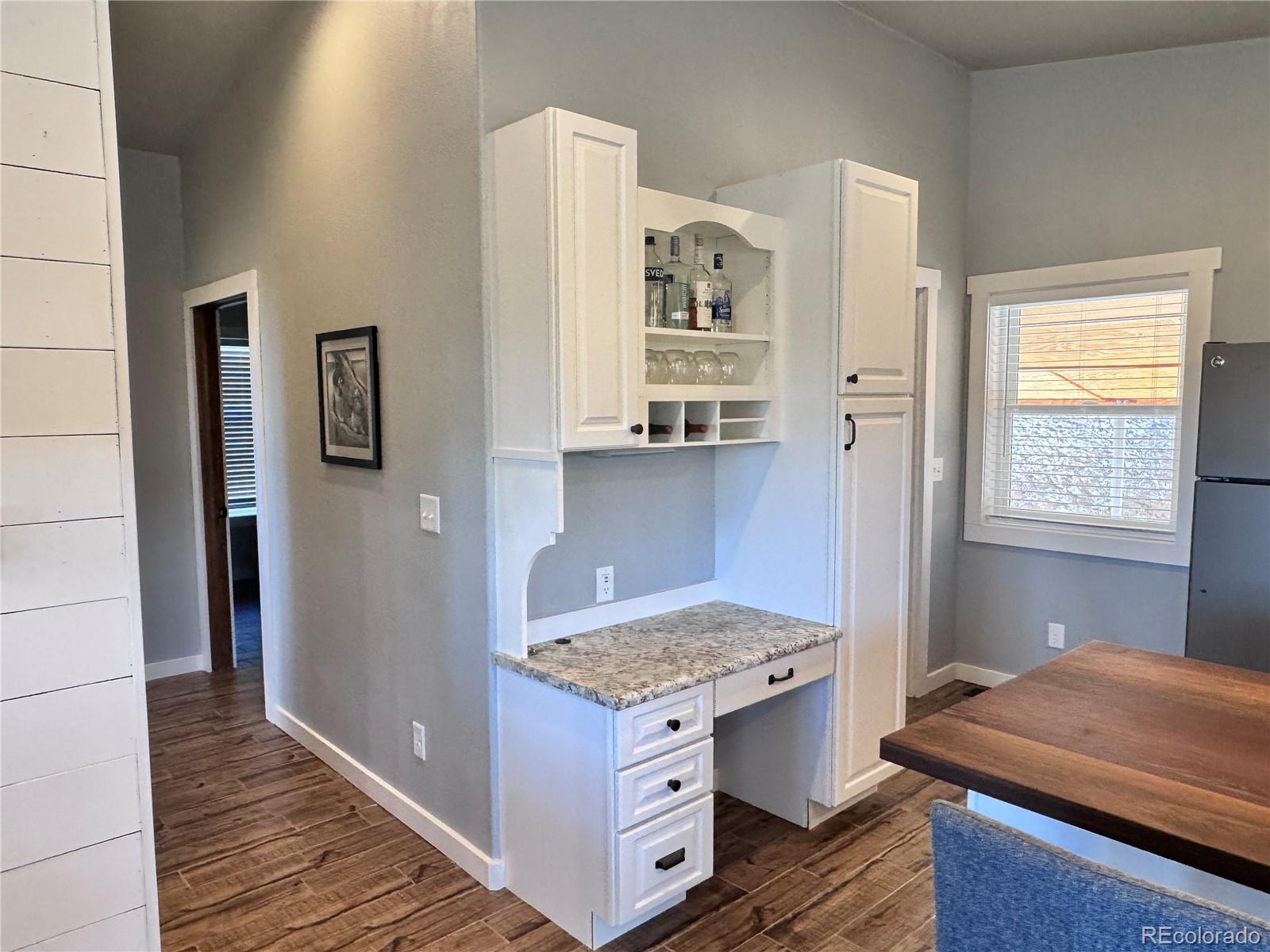 563 Kankakee Road Westcliffe, CO 81252 - Photo 6 of 46 a kitchen with a stove and a refrigerator