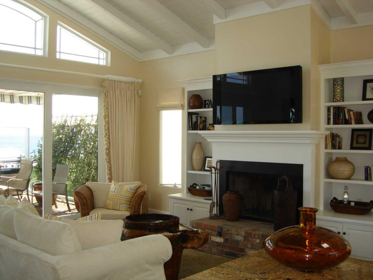 1631 Posilipo Lane Montecito, CA 93108 - Photo 10 of 11 a living room with furniture a fireplace and a flat screen tv