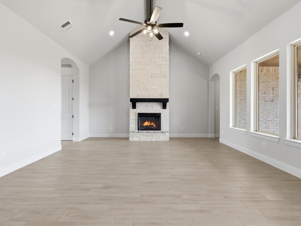 829 Haley Springtown, TX 76082 - Photo 11 of 37 a view of an empty room with a fireplace and a window