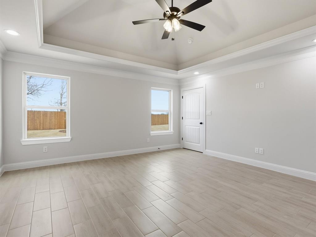 829 Haley Springtown, TX 76082 - Photo 25 of 37 wooden floor in an empty room with a window