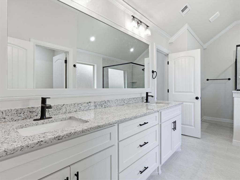 829 Haley Springtown, TX 76082 - Photo 26 of 37 a bathroom with a granite countertop sink double and mirror