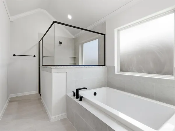 a bathroom with a bathtub and a shower