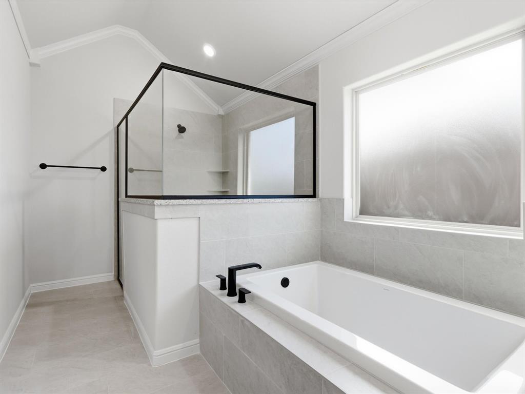 829 Haley Springtown, TX 76082 - Photo 27 of 37 a bathroom with a bathtub and a shower