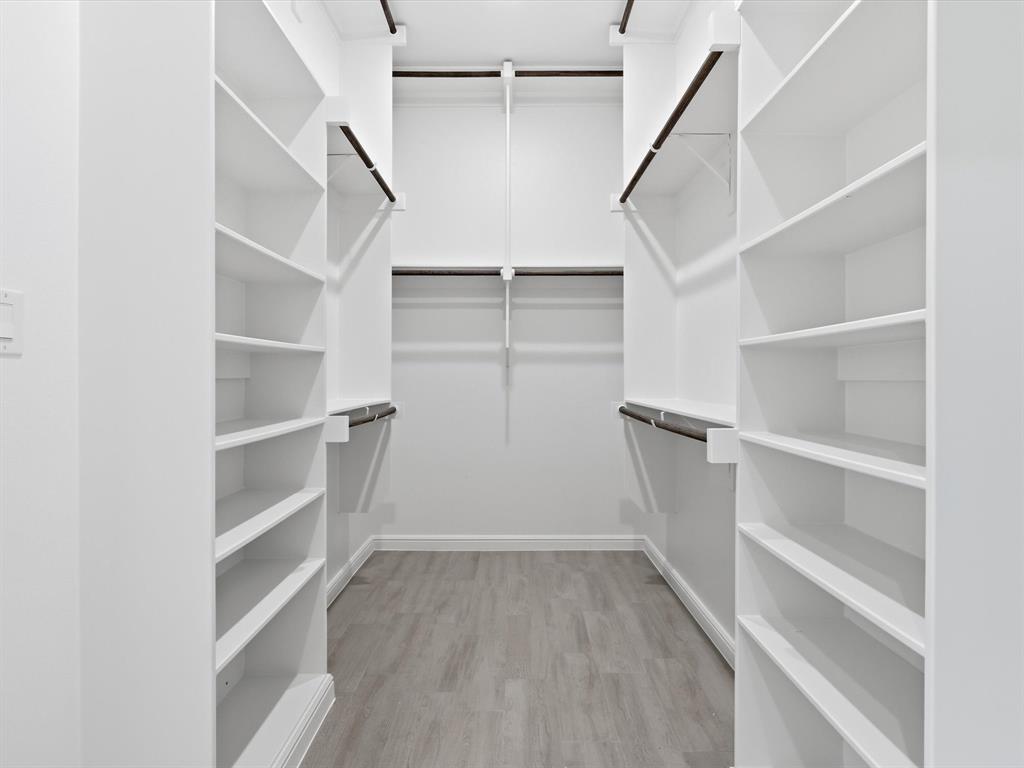 829 Haley Springtown, TX 76082 - Photo 28 of 37 a view of walk in closet with empty racks