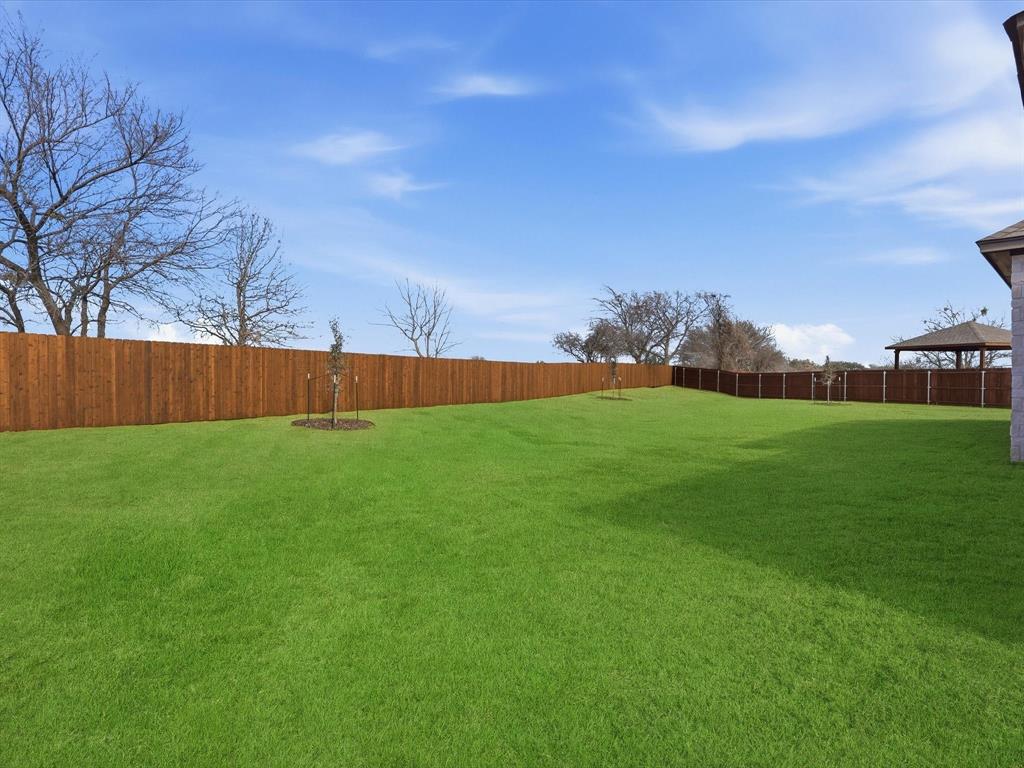 829 Haley Springtown, TX 76082 - Photo 32 of 37 a view of yard with swimming pool and wooden fence
