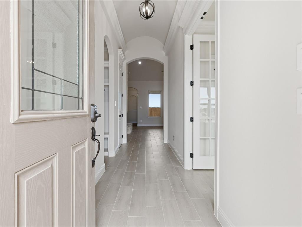 829 Haley Springtown, TX 76082 - Photo 4 of 37 a view of a hallway with wooden floor and staircase