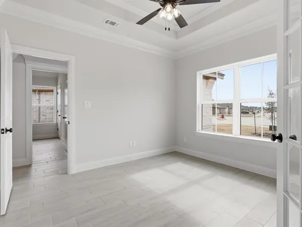 a view of an empty room with a window