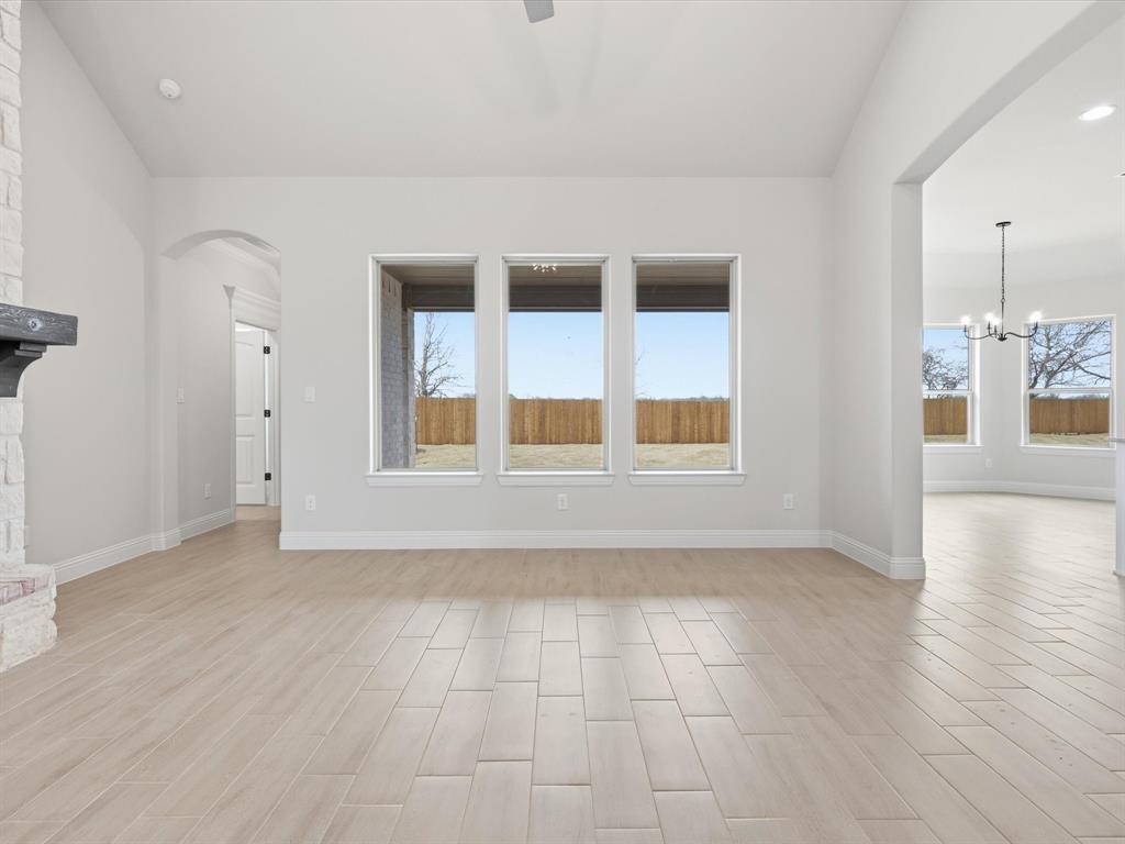 829 Haley Springtown, TX 76082 - Photo 9 of 37 a view of an empty room with window and wooden floor