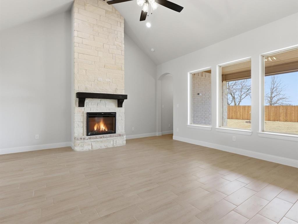 829 Haley Springtown, TX 76082 - Photo 10 of 37 a view of an empty room with a fireplace and a window