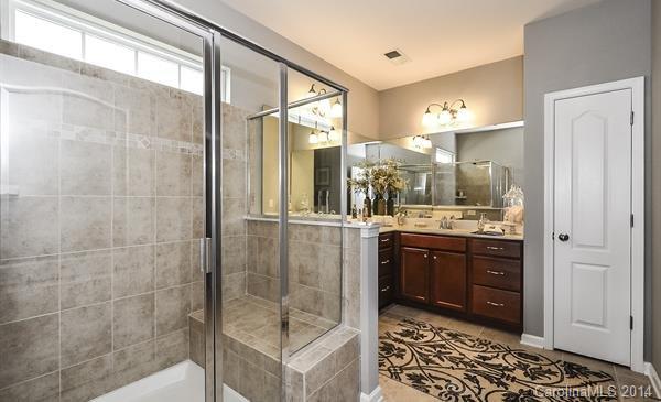4308 Perth Road, Unit 320 Indian Land, SC 29707 - Photo 8 of 11 a bathroom with a shower sink and mirror