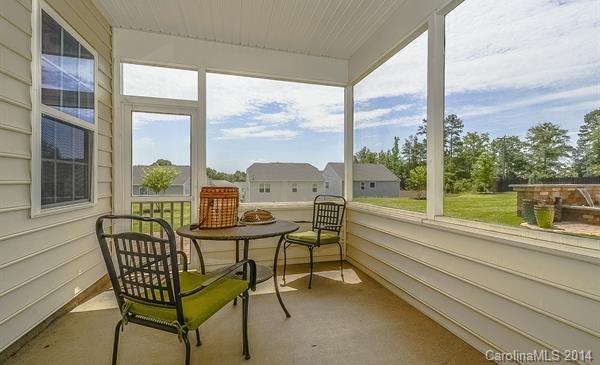 4308 Perth Road, Unit 320 Indian Land, SC 29707 - Photo 9 of 11 a balcony with couple of chairs and a tables