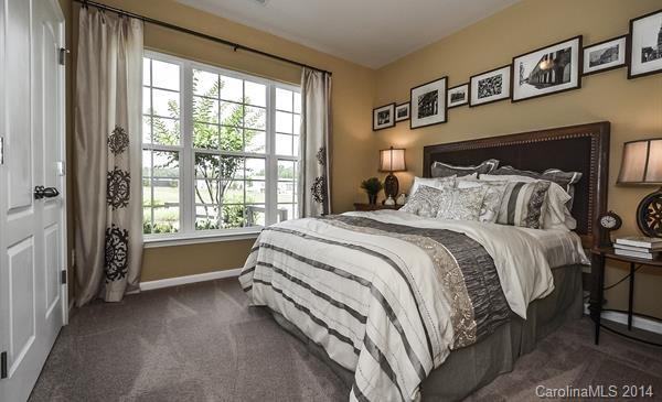 4308 Perth Road, Unit 320 Indian Land, SC 29707 - Photo 10 of 11 a spacious bedroom with a bed and a large window