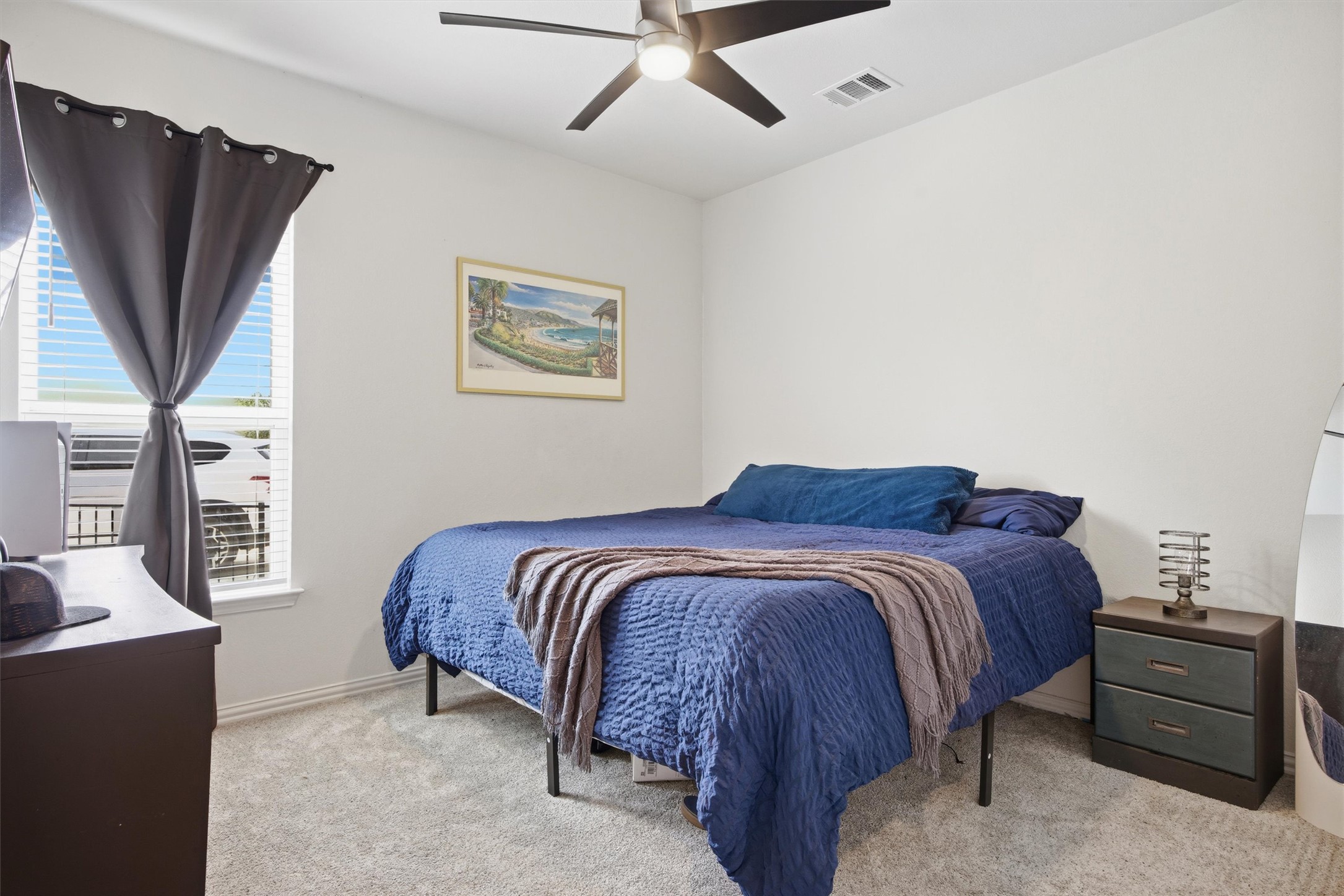 192 Raptor Beak Way Cedar Creek, TX 78612 - Photo 29 of 38 Neutral interior room with light gray carpeting, a window with horizontal blinds, and a ceiling fan
