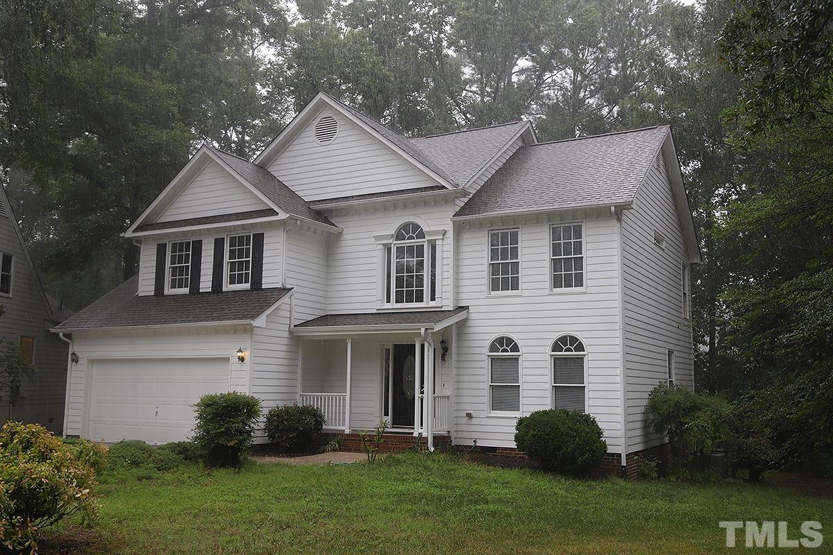 405 Lippershey Court Cary, NC 27513 - Photo 1 of 17 a front view of a house with a garden and plants