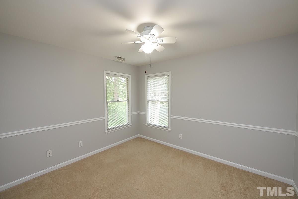 405 Lippershey Court Cary, NC 27513 - Photo 14 of 17 an empty room with windows and fan