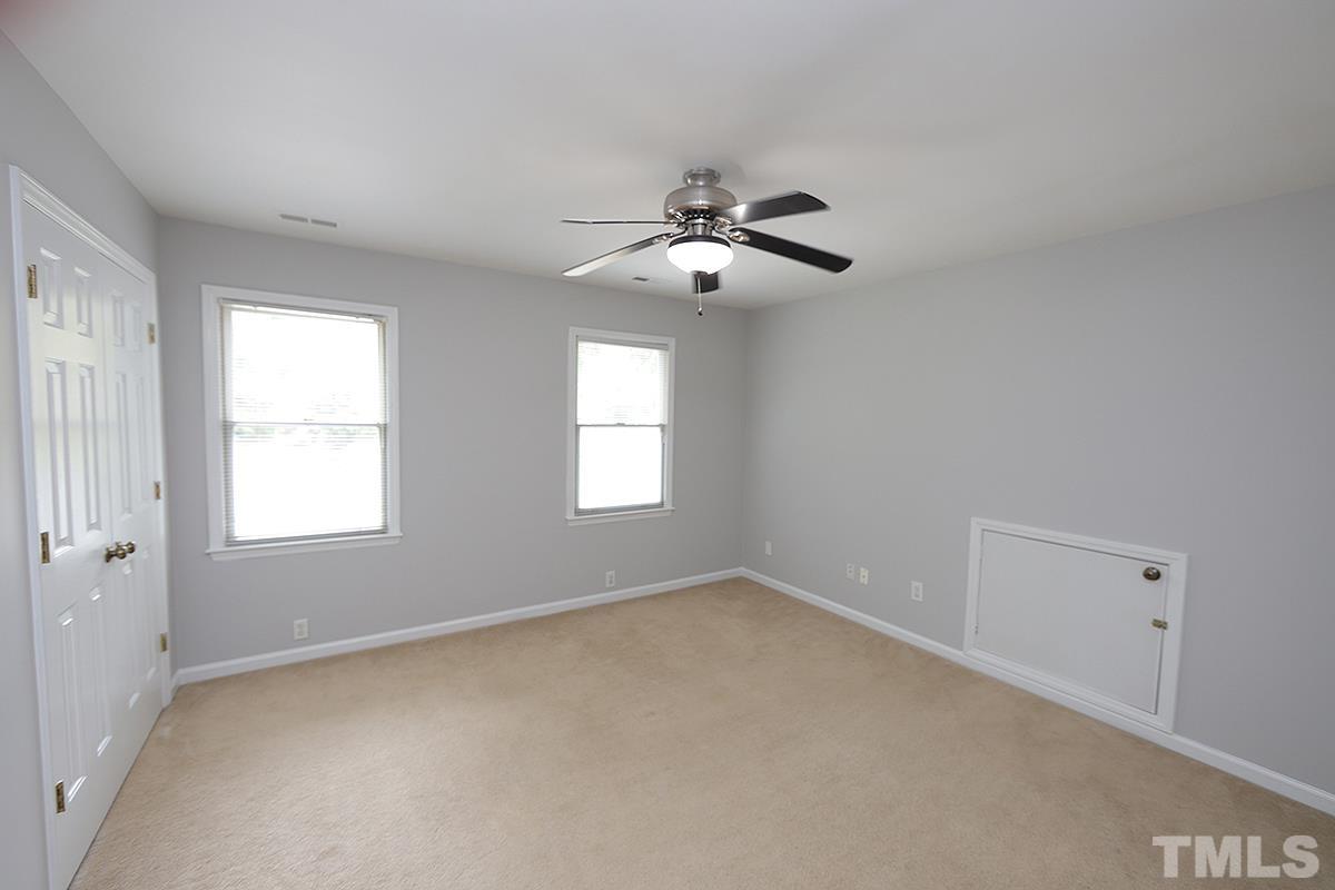405 Lippershey Court Cary, NC 27513 - Photo 17 of 17 a view of room with a ceiling fan and window