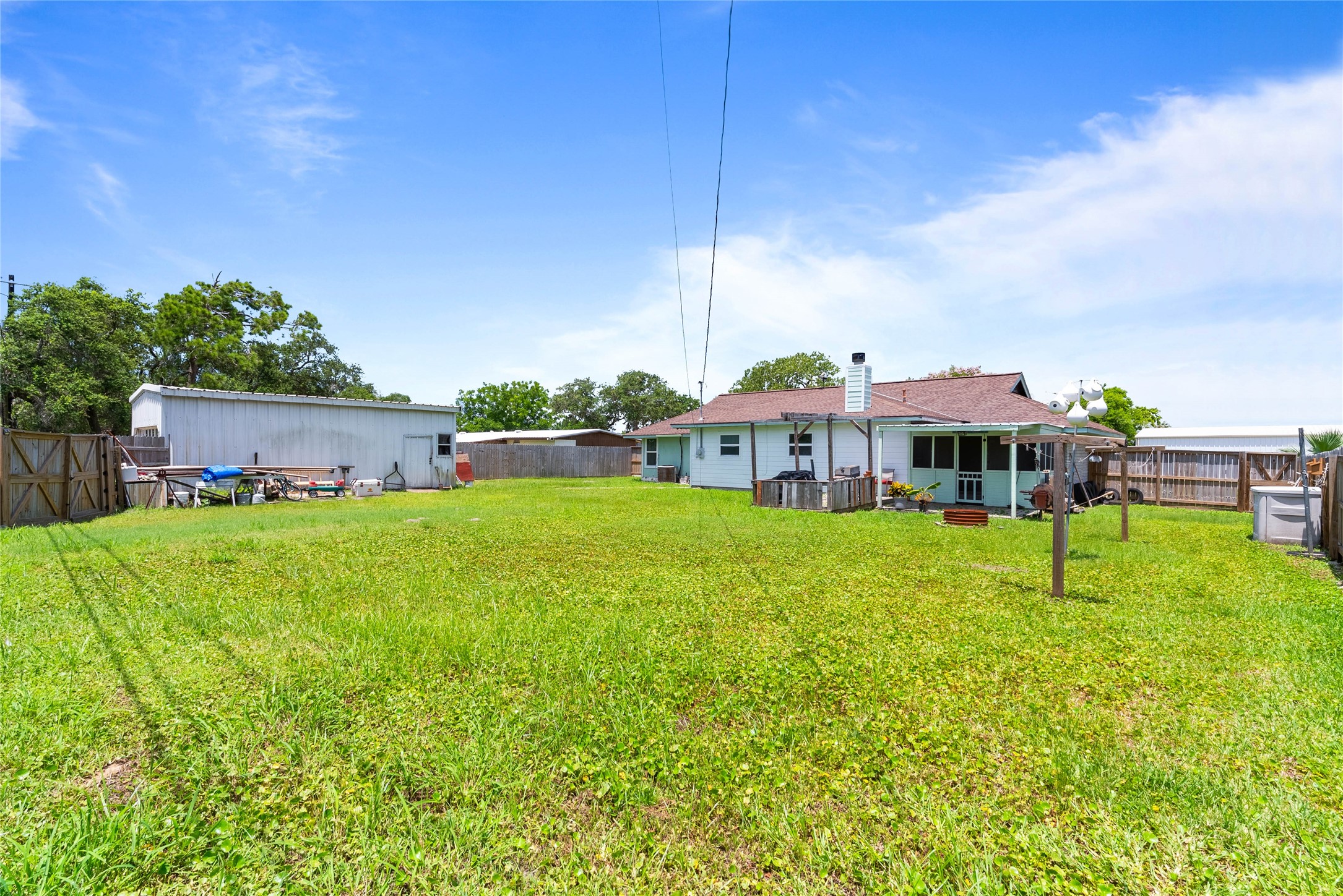 168 Sunset Ingleside, TX 78362 - Photo 23 of 26 Massive, fully fenced backyard offering endless possibilities for recreation or gardening.