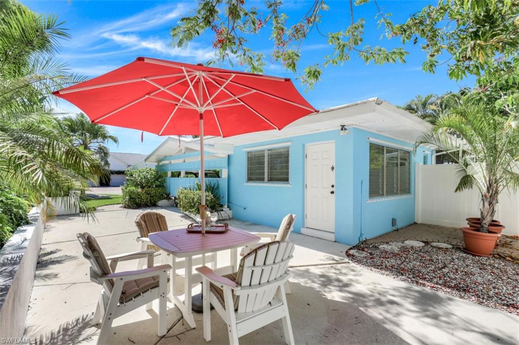 409 3rd Avenue North Naples, FL 34102 - Photo 11 of 41 a view of a house with backyard and sitting area