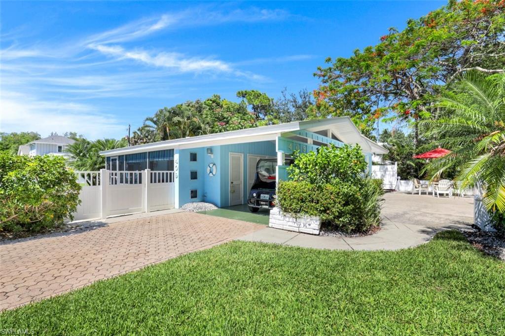 409 3rd Avenue North Naples, FL 34102 - Photo 13 of 41 a front view of a house with a yard