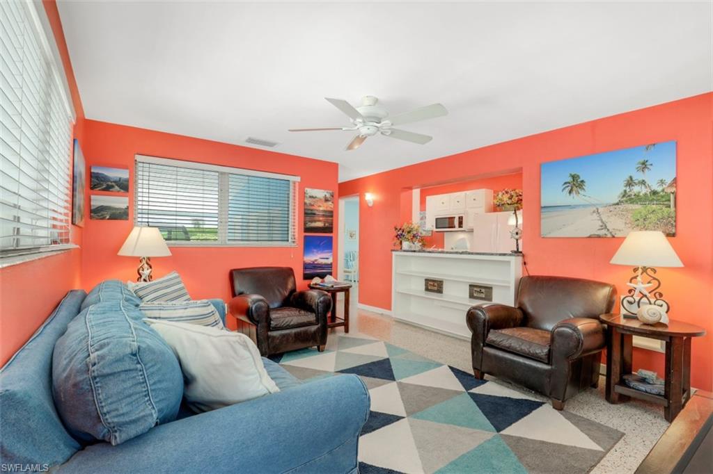 409 3rd Avenue North Naples, FL 34102 - Photo 21 of 41 a living room with furniture and a large window