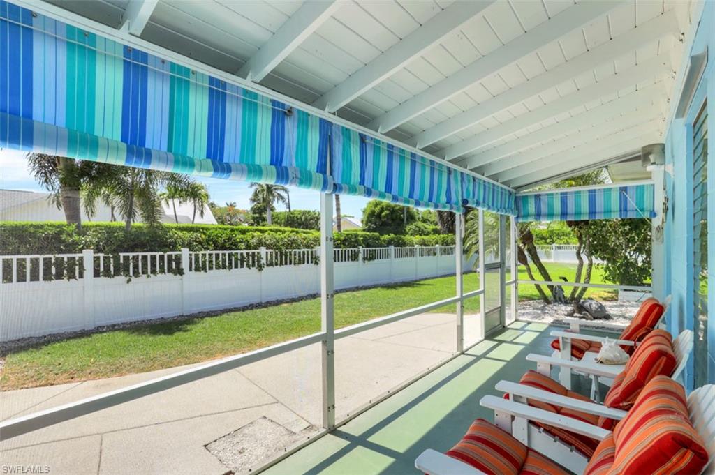 409 3rd Avenue North Naples, FL 34102 - Photo 27 of 41 a view of a porch with furniture and garden