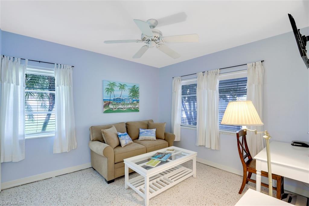 409 3rd Avenue North Naples, FL 34102 - Photo 28 of 41 a living room with furniture and a window