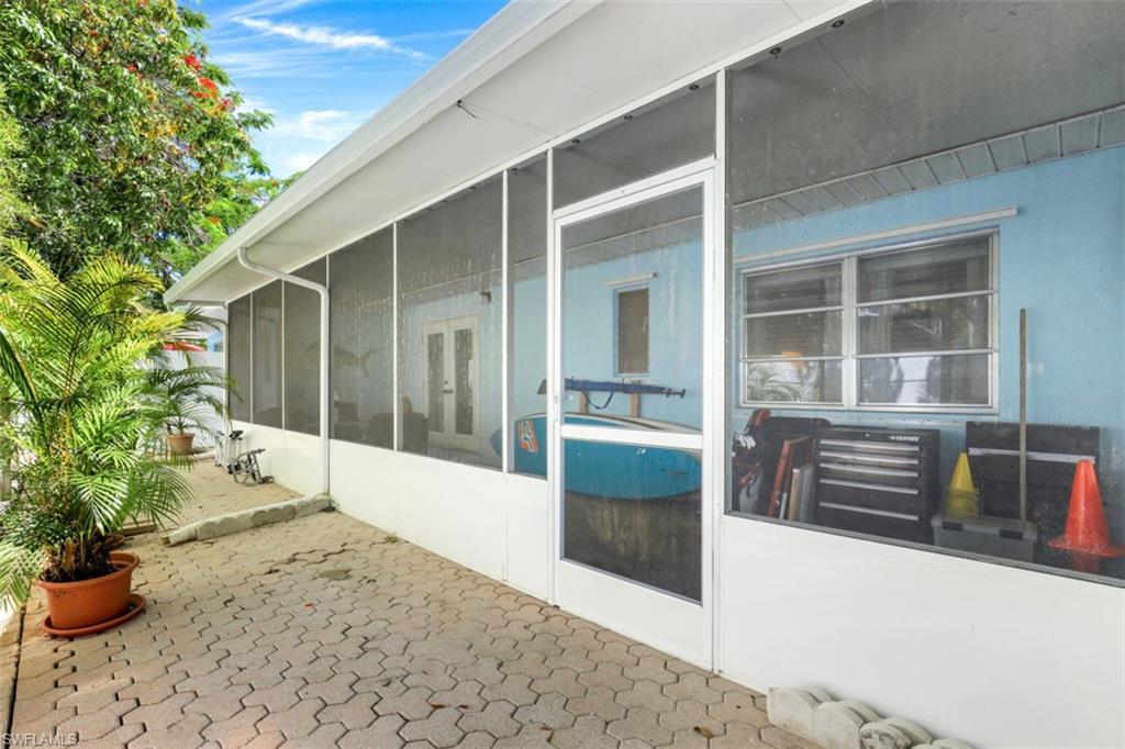 409 3rd Avenue North Naples, FL 34102 - Photo 33 of 41 a view of potted plant in front of a door