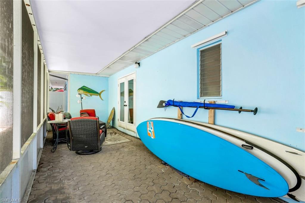 409 3rd Avenue North Naples, FL 34102 - Photo 34 of 41 a living room with furniture and a wooden floor
