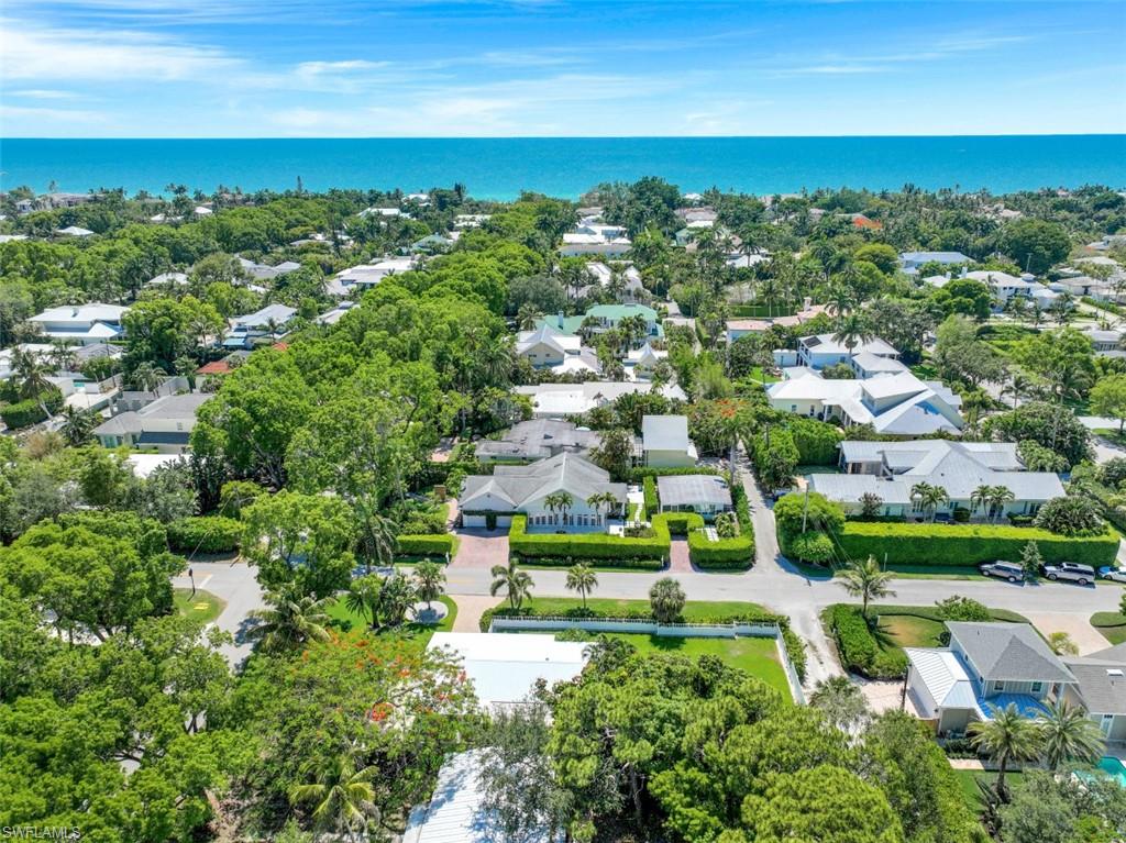 409 3rd Avenue North Naples, FL 34102 - Photo 4 of 41 an aerial view of residential houses with outdoor space and trees