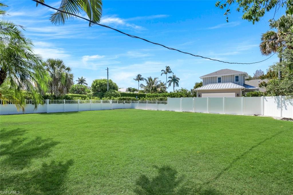 409 3rd Avenue North Naples, FL 34102 - Photo 41 of 41 a view of a house with a yard and potted plants