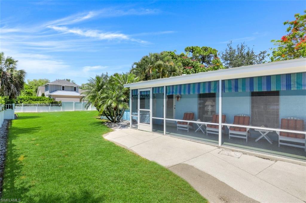 409 3rd Avenue North Naples, FL 34102 - Photo 6 of 41 a house with garden in front of it