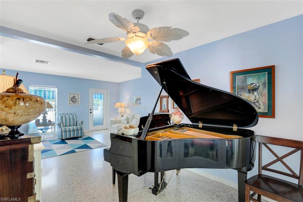 409 3rd Avenue North Naples, FL 34102 - Photo 9 of 41 a bedroom with furniture and window