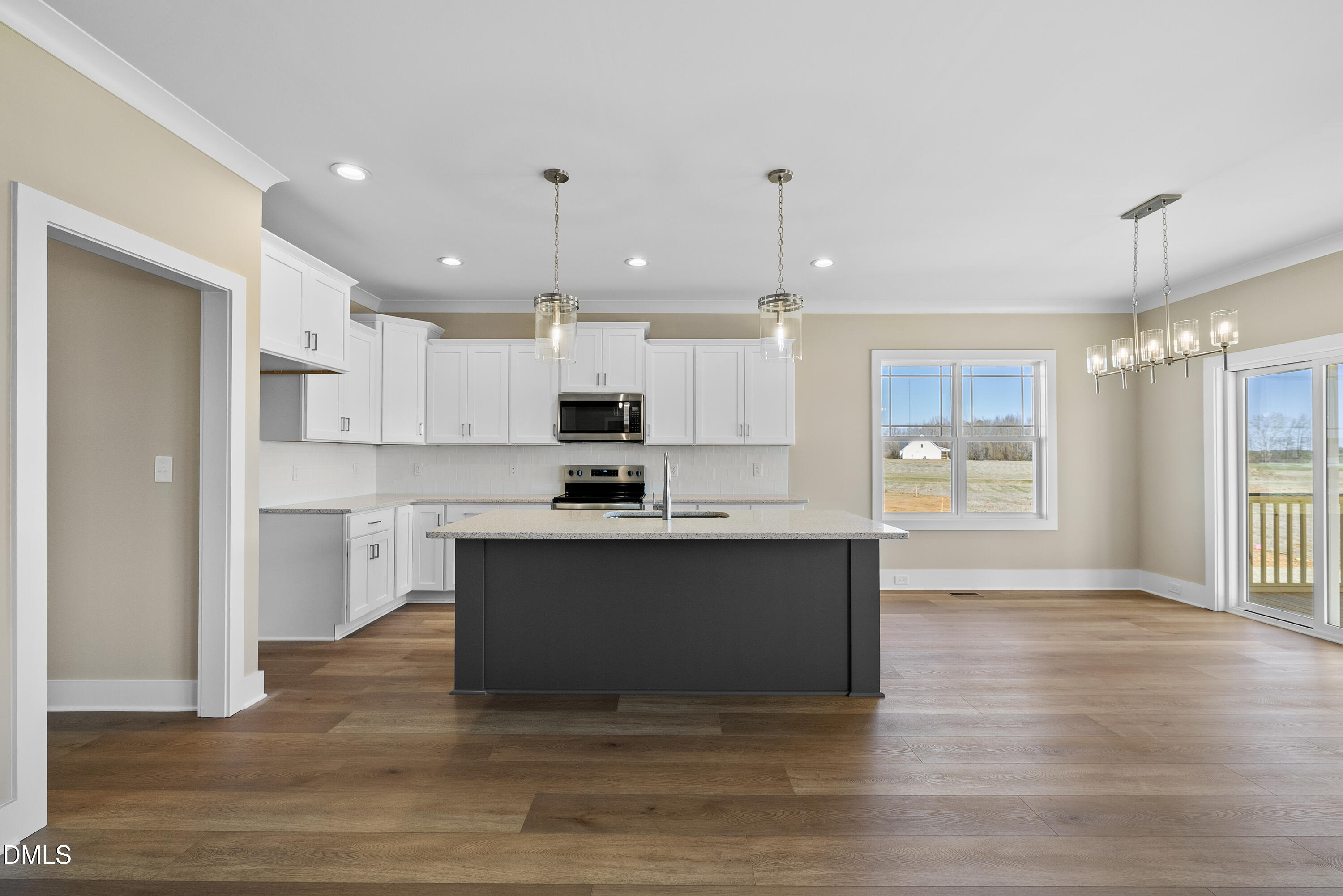 5549 River Buck Rd Spring Spring Hope, NC 27882 - Photo 4 of 35 a large kitchen with cabinets and wooden floor