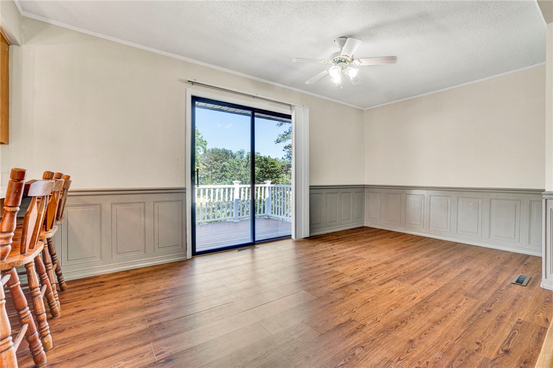 7876 Highway 11 Walhalla, SC 29691 - Photo 16 of 35 Hardwood flooring extends into this spacious dining area with direct outdoor access.