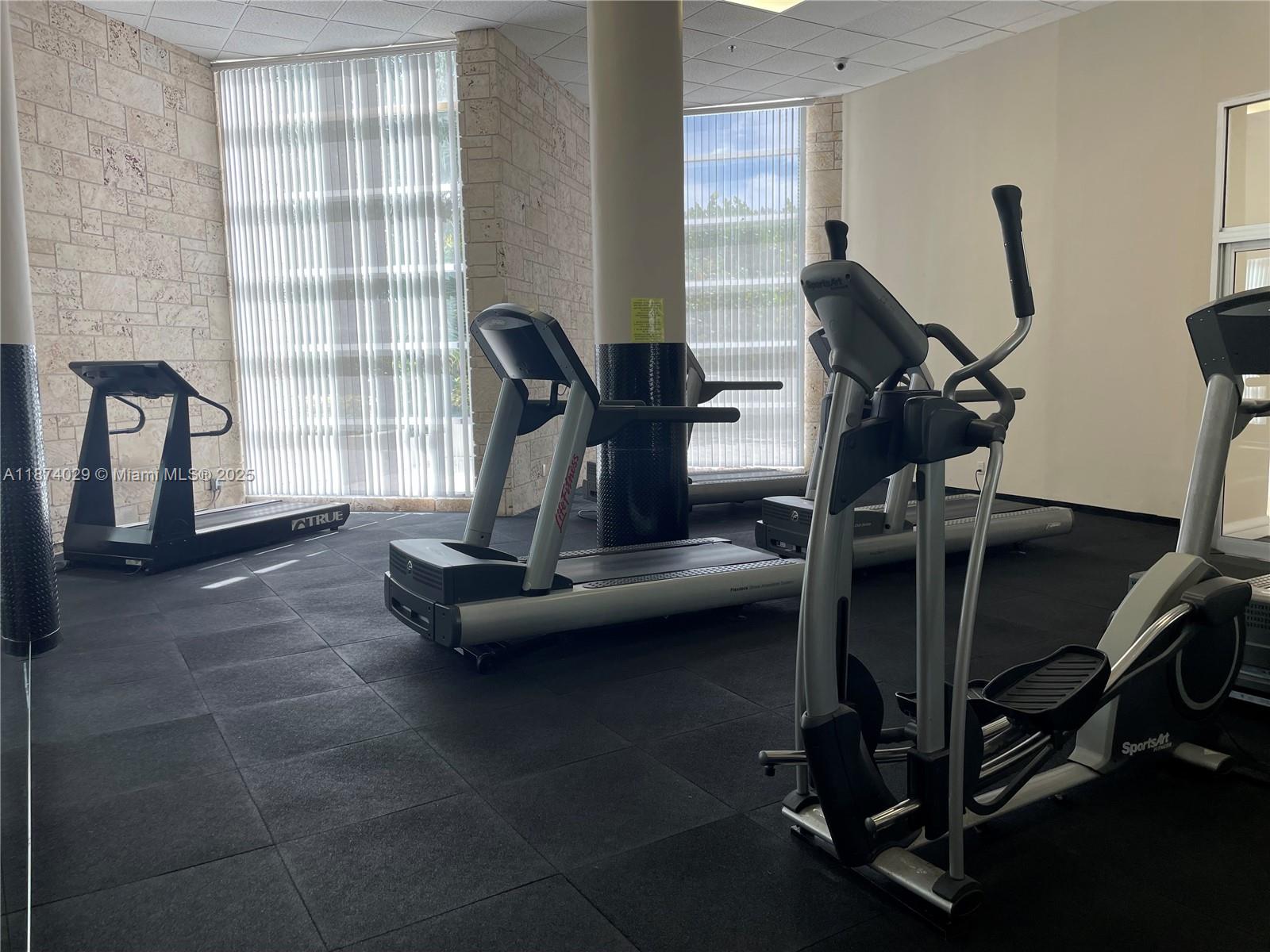 5151 Collins Avenue, Unit 1525 Miami Beach, FL 33140 - Photo 17 of 17 a view of a room with gym equipment