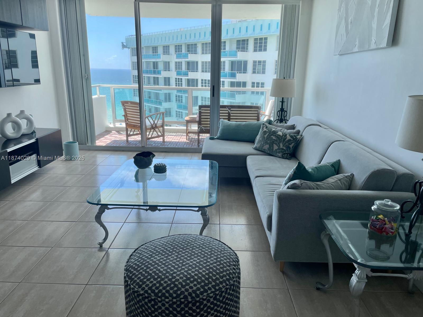 5151 Collins Avenue, Unit 1525 Miami Beach, FL 33140 - Photo 2 of 17 a living room with furniture